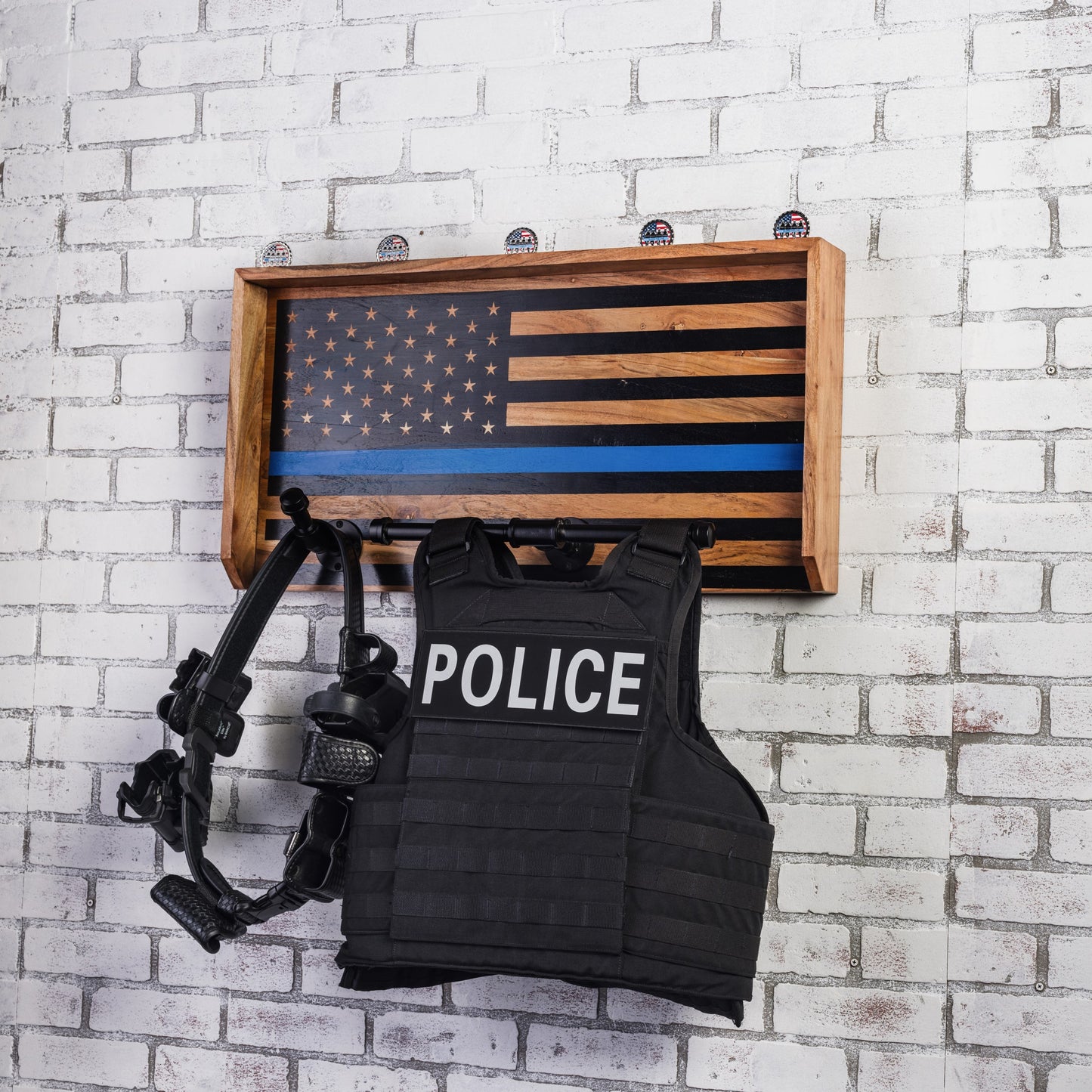 Vest holder with secure hooks for body armor and police uniforms