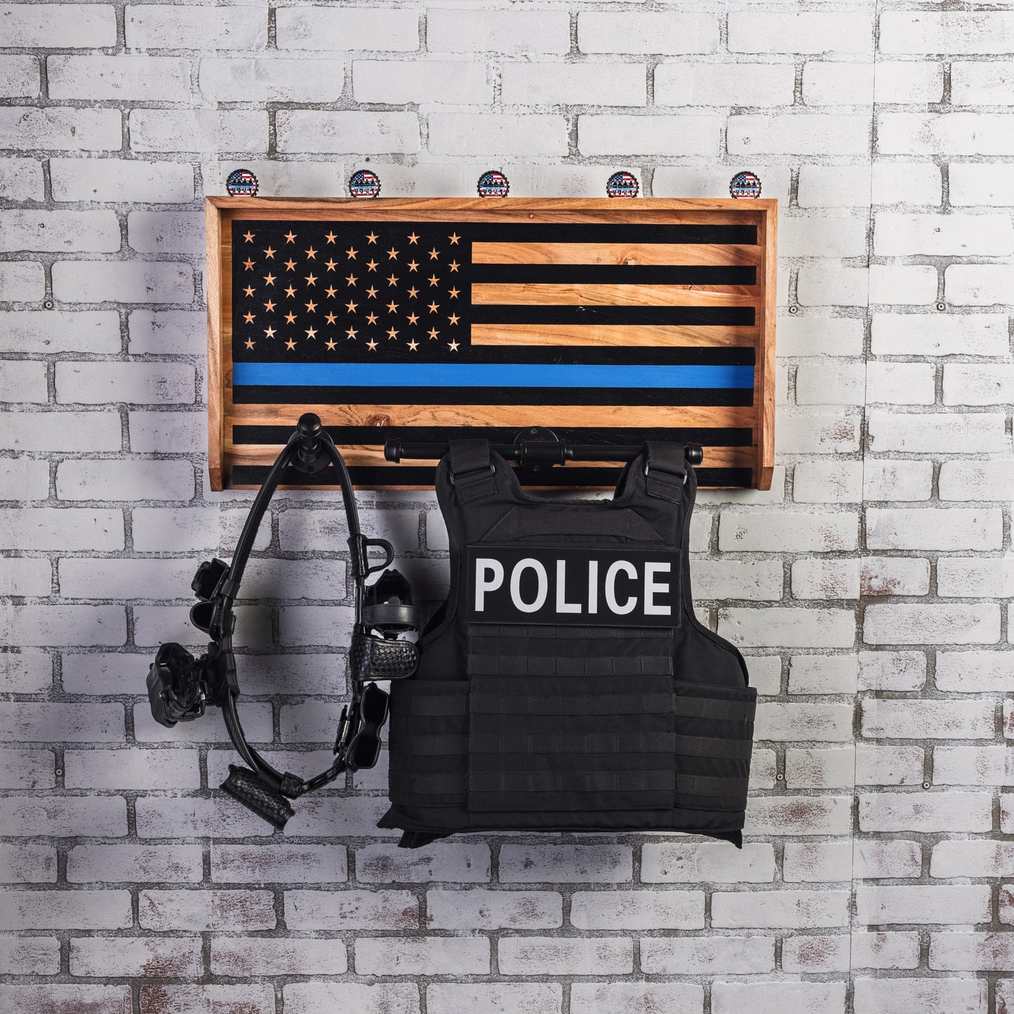 Law enforcement gear stand for vests, uniforms, and duty equipment.
