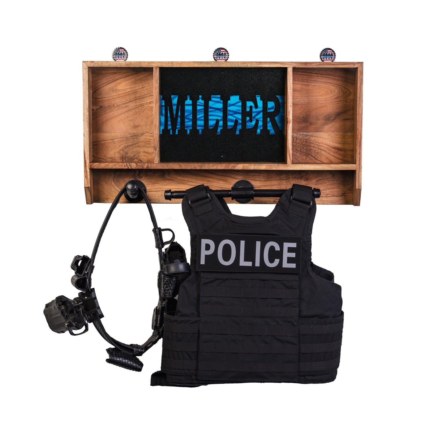 Personalized wall mounted police gear rack with custom name. The tactical rack is storing a duty vest, patrol belt, and challenge coins.
