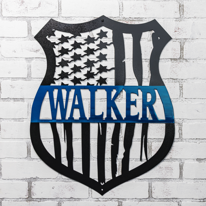 Personalized monogram badge sign with American flag cutout and thin blue line decor for police officers.