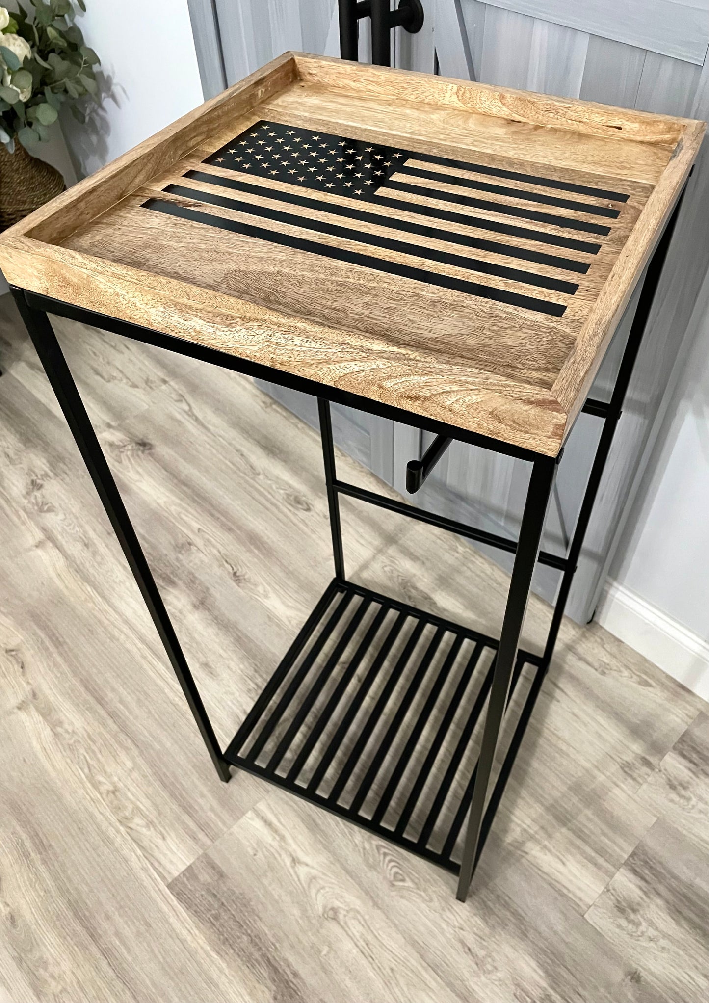 Police gear stand with American flag used to organize and display cop gear. 