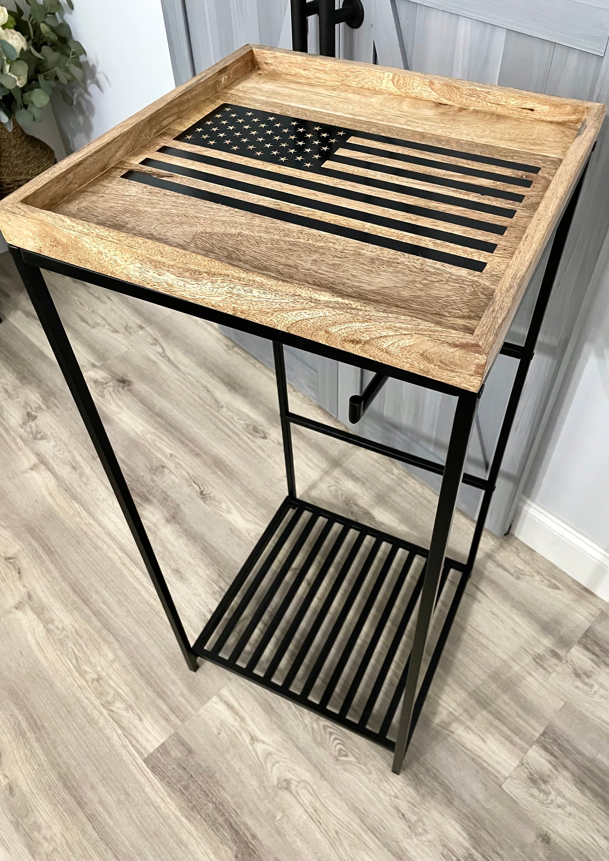 Police gear stand with American flag used to organize and display cop gear. 